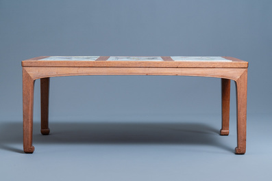 A Chinese wooden table with three qianjiang cai plaques, 19/20th C.