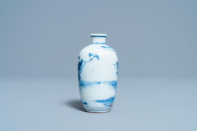 A small Chinese blue, white and copper-red vase, 19th C.