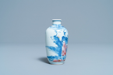 A small Chinese blue, white and copper-red vase, 19th C.