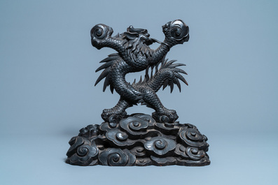 A large Chinese carved wooden 'dragon' stand for a dish or a mirror, 19th C.