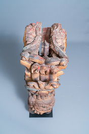 Two Chinese gilded and polychromed wooden colon fragments with Buddhist lions, 18/19th C.