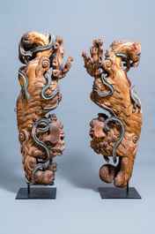 Two Chinese gilded and polychromed wooden colon fragments with Buddhist lions, 18/19th C.
