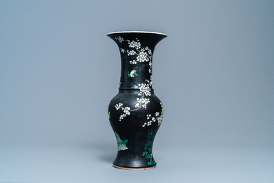 A Chinese famille noire 'magpie and prunus' yenyen vase, Kangxi