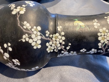 A Chinese famille noire 'magpie and prunus' yenyen vase, Kangxi