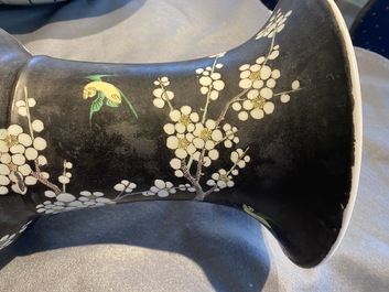 A Chinese famille noire 'magpie and prunus' yenyen vase, Kangxi