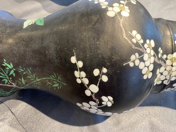 A Chinese famille noire 'magpie and prunus' yenyen vase, Kangxi