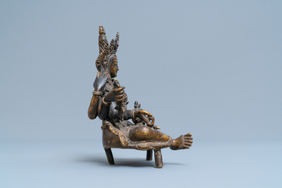 A Nepalese solid bronze figure of Vasudhara, 19th C.
