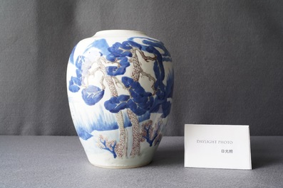 Een Chinese blauw-witte, koperrode en celadon vaas met landschapsdecor, Kangxi
