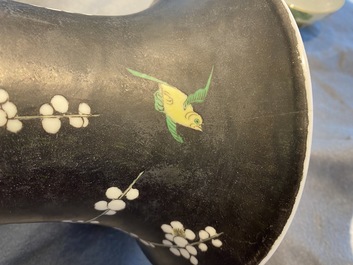 A Chinese famille noire 'magpie and prunus' yenyen vase, Kangxi