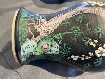 A Chinese famille noire 'magpie and prunus' yenyen vase, Kangxi