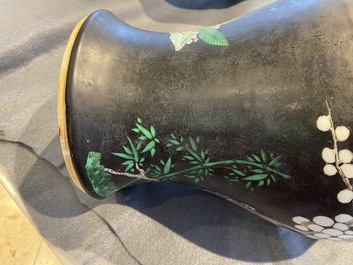 A Chinese famille noire 'magpie and prunus' yenyen vase, Kangxi