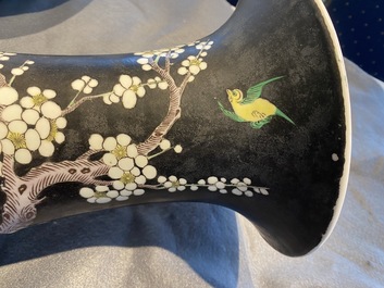 A Chinese famille noire 'magpie and prunus' yenyen vase, Kangxi