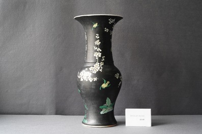 A Chinese famille noire 'magpie and prunus' yenyen vase, Kangxi