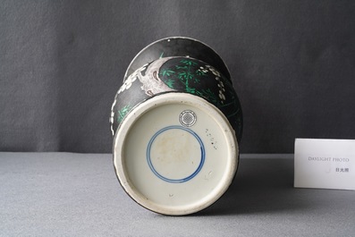 A Chinese famille noire 'magpie and prunus' yenyen vase, Kangxi