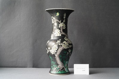 A Chinese famille noire 'magpie and prunus' yenyen vase, Kangxi