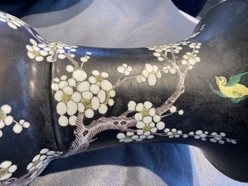 A Chinese famille noire 'magpie and prunus' yenyen vase, Kangxi
