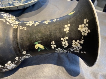 A Chinese famille noire 'magpie and prunus' yenyen vase, Kangxi