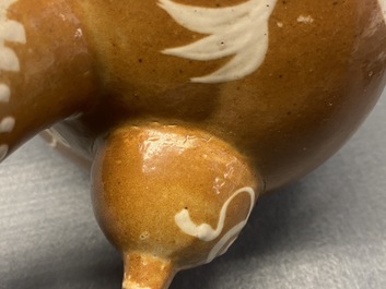 A rare Chinese slip-decorated brown-ground Swatow kendi, Ming