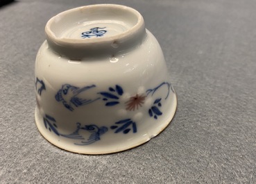 Six Chinese blue, white and copper red cups and saucers, Kangxi