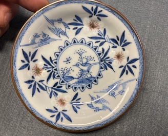 Six Chinese blue, white and copper red cups and saucers, Kangxi