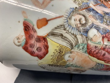 A Chinese famille rose 'luohan and mythical animals' vase, 19/20th C.
