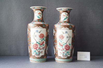 A pair of Chinese famille rose rouleau vases, 19th C.
