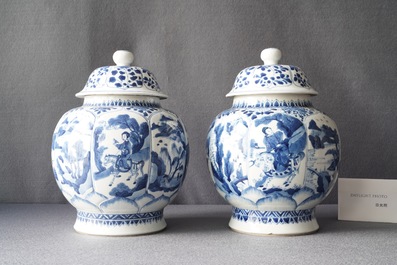 A pair of Chinese blue and white 'hunting scene' jars and covers, Kangxi