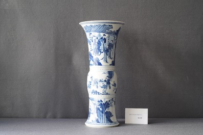 A Chinese blue and white 'gu' vase with figurative design, Kangxi