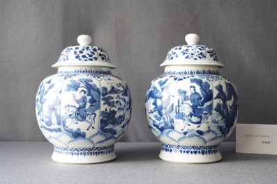 A pair of Chinese blue and white 'hunting scene' jars and covers, Kangxi