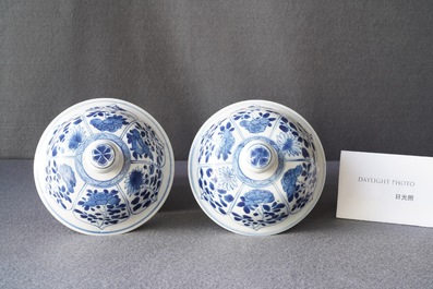 A pair of Chinese blue and white 'hunting scene' jars and covers, Kangxi