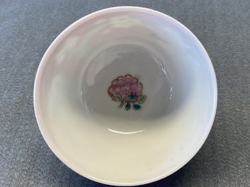 A Chinese famille rose ruby-ground cup and saucer, Yongzheng