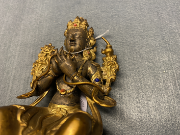 A Chinese gilt bronze figure of Buddha, 18/19th C.