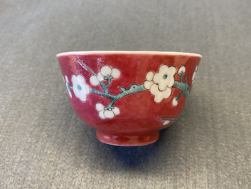A Chinese famille rose ruby-ground cup and saucer, Yongzheng