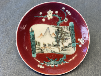 A Chinese famille rose ruby-ground cup and saucer, Yongzheng