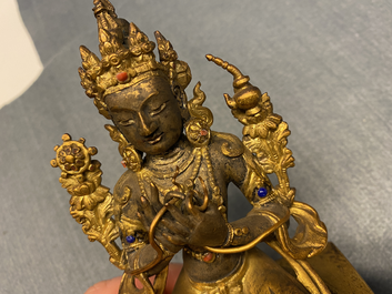 A Chinese gilt bronze figure of Buddha, 18/19th C.