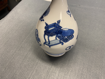 A Chinese blue and white 'antiquities' bottle vase, Kangxi