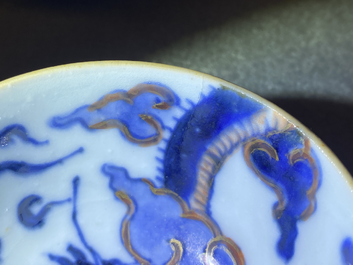 Six Chinese doucai 'dragon' cups and saucers, Kangxi