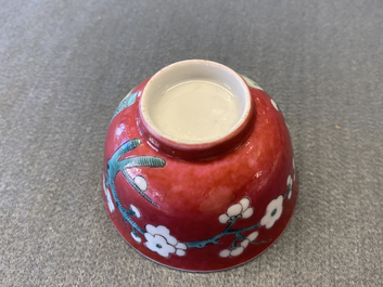 A Chinese famille rose ruby-ground cup and saucer, Yongzheng