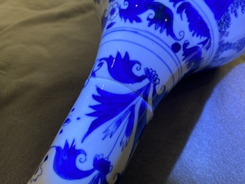 A Chinese blue and white bottle vase with figures in a landscape, Transitional period