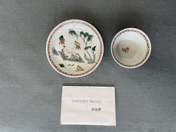 A Chinese famille verte 'erotical subject' cup and saucer, Kangxi