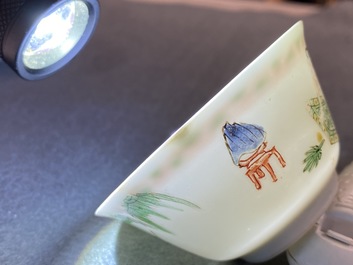 A Chinese famille verte 'erotical subject' cup and saucer, Kangxi