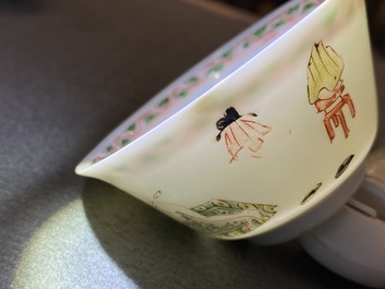 A Chinese famille verte 'erotical subject' cup and saucer, Kangxi