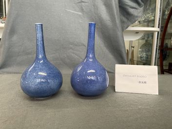 A pair of Chinese monochrome powder blue bottle vases, Kangxi