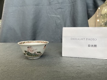A Chinese famille verte 'erotical subject' cup and saucer, Kangxi