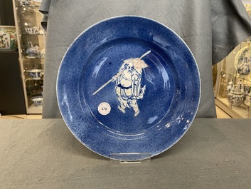 A Chinese blue, white and copper red powder blue-ground dish, Kangxi