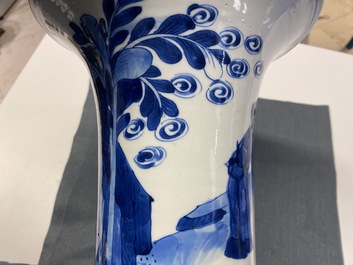 A Chinese blue and white 'gu' vase with figurative design, Kangxi