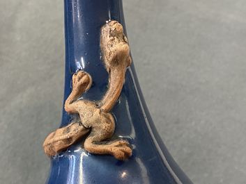A Chinese monochrome blue garlic head vase with applied biscuit dragon, Jiajing