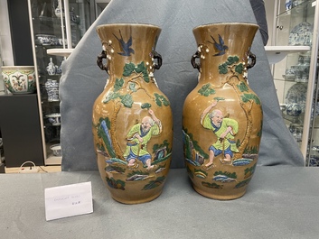 A pair of Chinese famille rose relief-molded vases and two with phoenixes, 19th C.