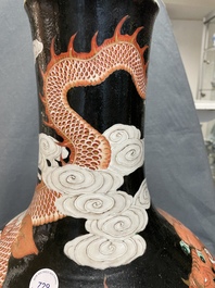 A Chinese famille noire 'dragon' bottle vase, 19th C.