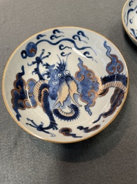 Six Chinese doucai 'dragon' cups and saucers, Kangxi